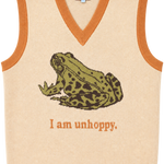 A cream-colored knit sweater vest with orange trim, featuring a knitted green and brown frog graphic and the text 'I am unhoppy.' on the front.