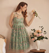 woman in floral green dress