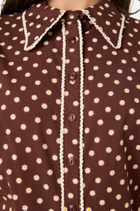 Brown shirt with white floral pattern and lace trim