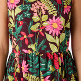 Dress with a vibrant floral and nature pattern on a dark background