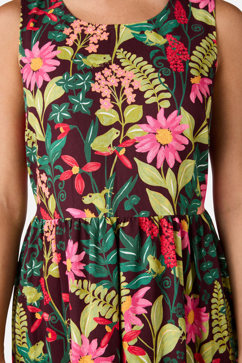 Dress with a vibrant floral and nature pattern on a dark background