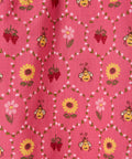 Pink fabric with bee and flower pattern