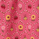 Pink fabric with bee and flower pattern