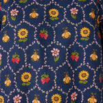 Navy blue fabric with colorful bee and floral pattern