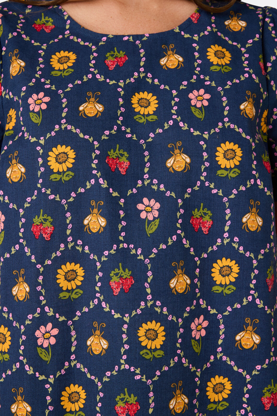 Navy blue fabric with colorful bee and floral pattern