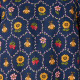Navy blue fabric with colorful bee and floral pattern