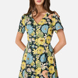 Woman wearing a floral dress with a white background