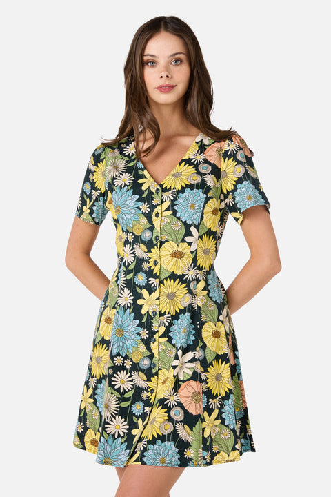 Woman wearing a floral dress with a white background