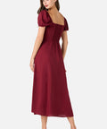 Woman wearing a burgundy dress on a white background