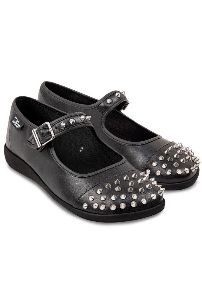 Black shoes with silver studs and buckles on a white background