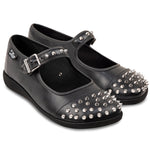 Black shoes with silver studs and buckles on a white background