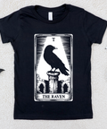 Black t-shirt with 'The Raven' tarot card design on a textured white background