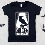 Black t-shirt with 'The Raven' tarot card design on a textured white background