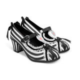 Black and white striped shoes with bow details on a white background