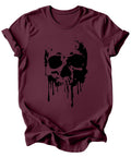 A maroon short-sleeve crewneck t-shirt featuring a black dripping skull graphic on the front, displayed against a solid white background.