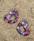Red, white, and blue marbled heart shaped hoop earrings