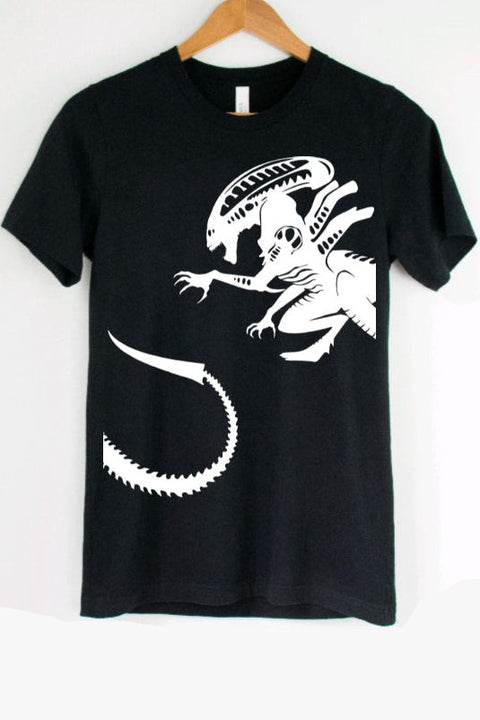 Black t-shirt with a white alien graphic on a hanger against a white background